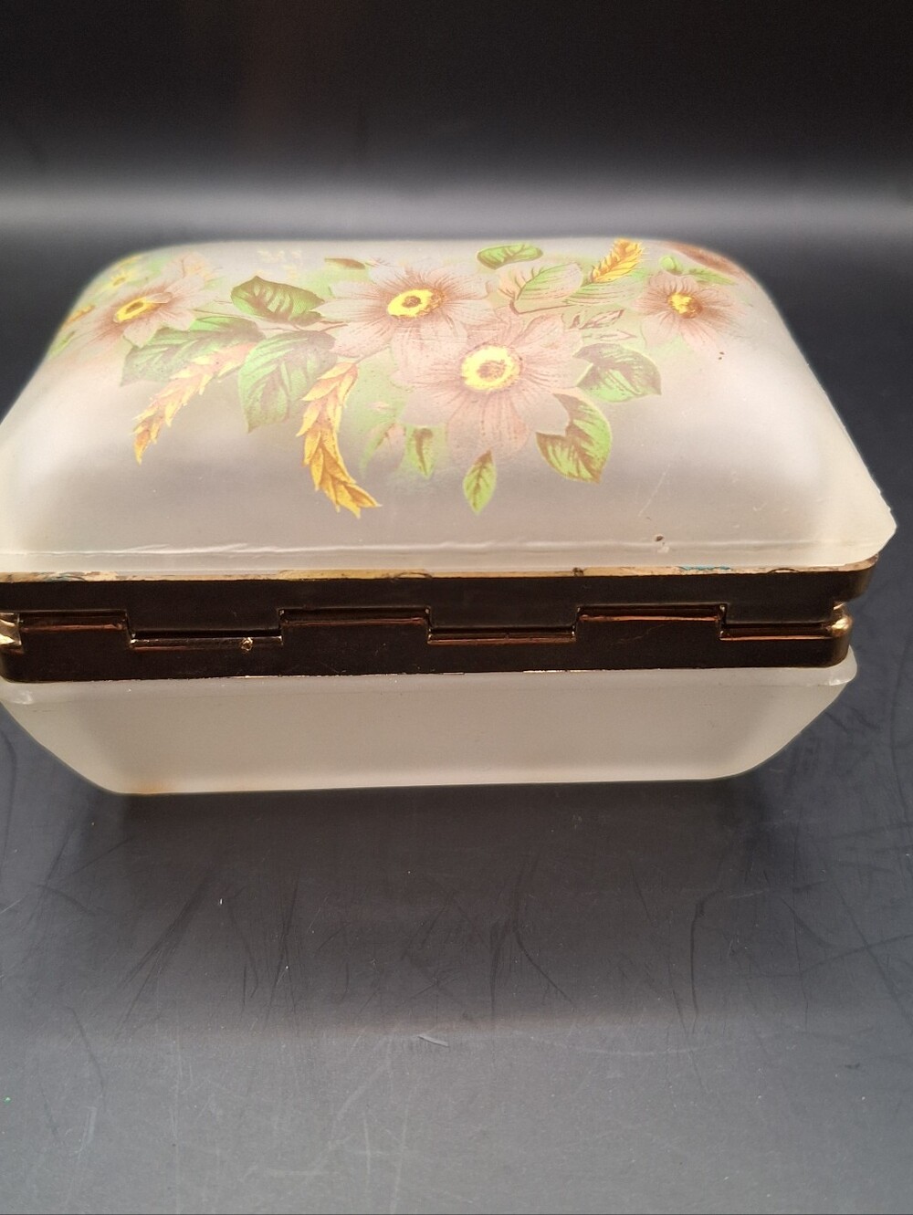 Vintage flower painted glass and brass hinged trinket box is a decorative collec